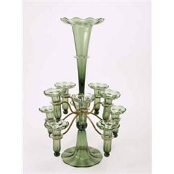 An Edwardian green glass epergne, composed of tall tapering trumpet vase and two rows of five sma...