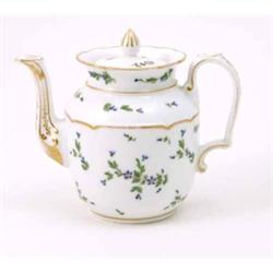 A French porcelain teapot, painted with restrained foliage in green and blue enamels and gilt, wi...