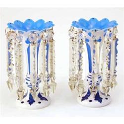 A pair of Victorian glass table lustres, in blue glass overlaid in opaque white with cut clear gl...