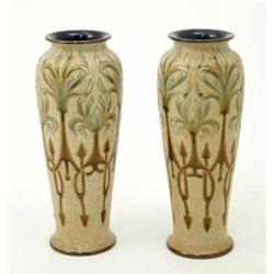 A pair of Royal Doulton Frank Butler vases, decorated with stylised foliate motifs, 10.25ins...