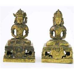 A near-pair of 19th century Sino-Tibetan gilt-bronze Buddhas, on pierced bases with concealed pra...