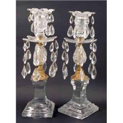 A pair of early 19th century cut glass and ormolu table lustres, with lustre drops pendant from s...