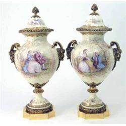 A pair of 20th century Sevres porcelain vases and covers, with ormolu horned-mask handles, mounts...