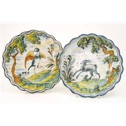 A Talavera pottery service in Urbino style, twenty-five plates, various sizes, painted with figur...