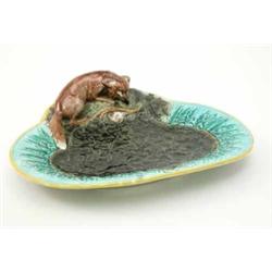 A Victorian majolica dessert dish, possibly Minton, modelled with a fox in pursuit of prey, the d...