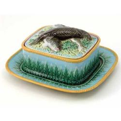 A George Jones majolica sardine dish, cover and stand, modelled with three fish lying against und...