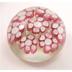 A French millefiore glass paperweight, inset with pink and white floral canes, two chips ground 3...