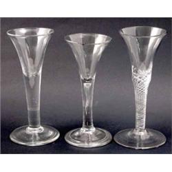 A George II air-twist wine glass, two-piece glass with conical foot (6.5in.), a ‘drawn trumpet’ g...