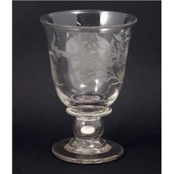 A 19th century glass coin goblet, engraved with foliage, the hollow stem inset with William IV si...