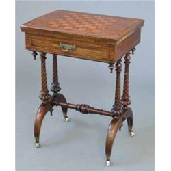 A Victorian walnut work table, with parquetry chessboard and swivelling baize lined top on spiral...