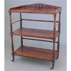 A fine Regency mahogany 3-tier buffet, with leaf carved pediment back on lappet carved columns an...