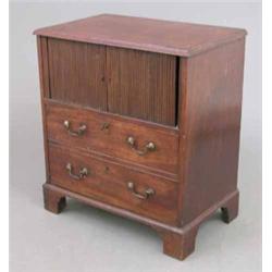 A George III mahogany night commode, with tambour over a dummy drawer fall front on bracket feet,...