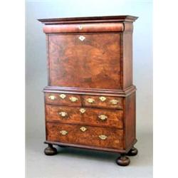 A George I walnut escritoire, with overhung moulded pediment, well fitted interior on contemporar...