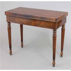 A William IV rosewood card table, with two concealed frieze drawers on reeded tapered legs, 2ft 1...