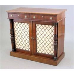 A Regency mahogany chiffonier, with two frieze drawers and brass grill doors, flanked by lappet c...