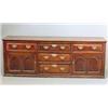 Image 1 : A mid 18th century oak dresser base, with five drawers and two doors, with double arch panels on...
