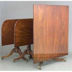 A fine Regency mahogany three pillar dining table, the top incorporating two spare leaves with ro...