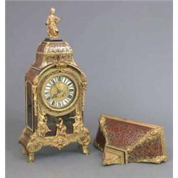 A Louis XV design red boulle bracket clock, ormolu mounted and cast with numerous figures, fitted...