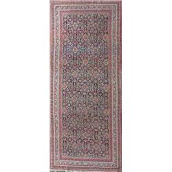 A late 19th century Khorrasan Kelleh carpet, the dark blue field with an overall herati design wi...