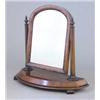 Image 1 : An early Victorian walnut toilet mirror, having arch topped cushion framed mirror with tapered co...