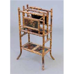 A Victorian bamboo canterbury, having two sections over open recess, inset floral painted lacquer...