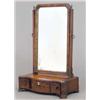 Image 1 : An early George III mahogany serpentine toilet mirror, with blind fret angles and three drawers o...