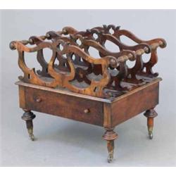 A Victorian design walnut and beech canterbury, with drawer on toupie legs, 1ft 9ins...