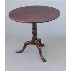 A George III mahogany circular occasional table, on ring turned stem and tripod, 2ft 7ins...