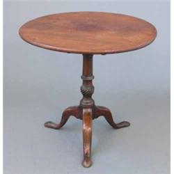 A George III mahogany circular occasional table, on spiral fluted stem and tripod (alterations) 2...