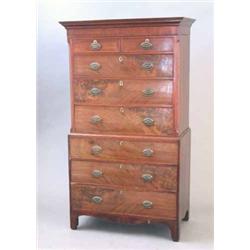 A George III mahogany chest on chest, with overhung moulded cornice and two short and six graduat...