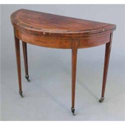 A George III mahogany and crossbanded demi-lune card table, with boxwood stringing on square tape...