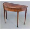 Image 1 : A George III mahogany and crossbanded demi-lune card table, with boxwood stringing on square tape...