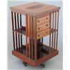 Image 1 : An Edwardian inlaid mahogany revolving bookcase, with three small drawers, 1ft 8ins...