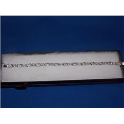 BRACELET - 6CTW (12) LIVELY BLUE TOPAZS & DIAMOND IN STERLING SILVER CROSS OVER LINK DESIGN SETTING 
