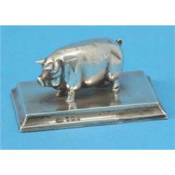 An Edwardian silver model of a pig, on rectangular plinth, Birmingham 1903, 3ins...