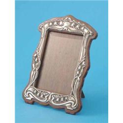 An Edwardian Art Nouveau silver mounted oak photo frame, decorated with campanula, Birmingham 190...