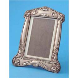 An Edwardian Art Nouveau silver photo frame, decorated with stylised foliate motifs, Birmingham 1...
