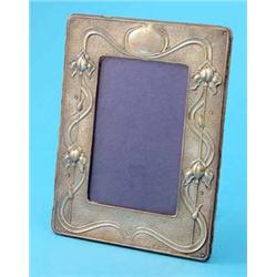 An Edwardian Art Nouveau silver photo frame, decorated with irises, Birmingham 1903, 8ins...