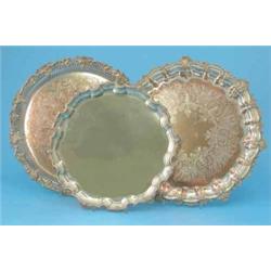Three assorted plated salvers, with piecrust and scroll borders, largest 15ins...