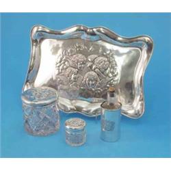 An Edwardian silver Reynolds Angels dressing table tray, and 3 silver mounted toilet jars...