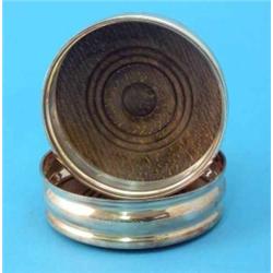 A pair of modern silver wine coasters....