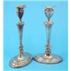 Image 1 : A pair of silver candlesticks with oval sconces, tapered stems and loaded feet, 1964, 11.5 ins....