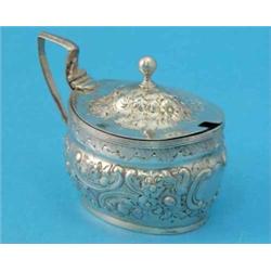 A George III silver drum mustard with later foliate scroll decoration, 1802....