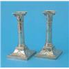 Image 1 : A pair of Edwardian silver candlesticks with ionic column stems and loaded swept square bases, 19...