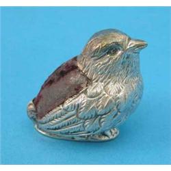 An Edwardian silver chick novelty pin cushion....
