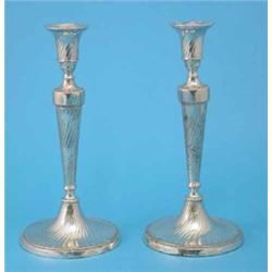 A pair of George III silver candlesticks with spiral fluting and loaded circular bases, Sheffield...