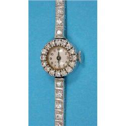 A lady’s platinum and diamond cocktail watch with circular dial....