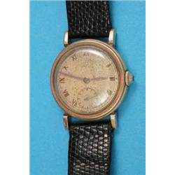A gentleman’s 9ct gold Omega wrist watch with gilt Roman dial....