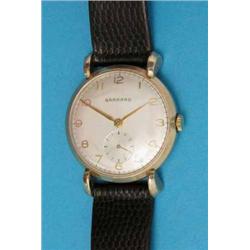 A gentleman’s 9ct gold Garrard wrist watch with Arabic dial....