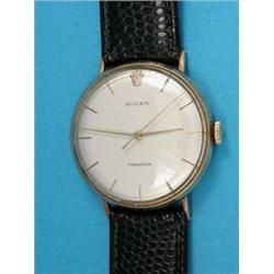 A gentleman’s 9ct gold Rolex Precision wrist watch with circular case and baton numerals....